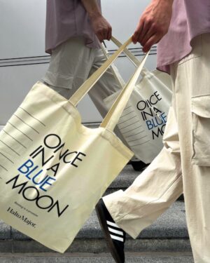 Model Holding a Oce In a Blue Moon Tote Bag